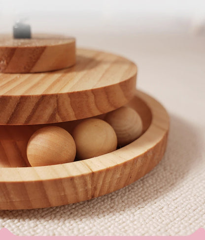 Interactive wood cat turntable toy with rolling ball.